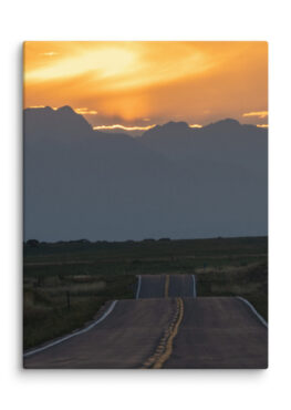 Canvas Print: A Sunset Over The Road With Mountains In Background
