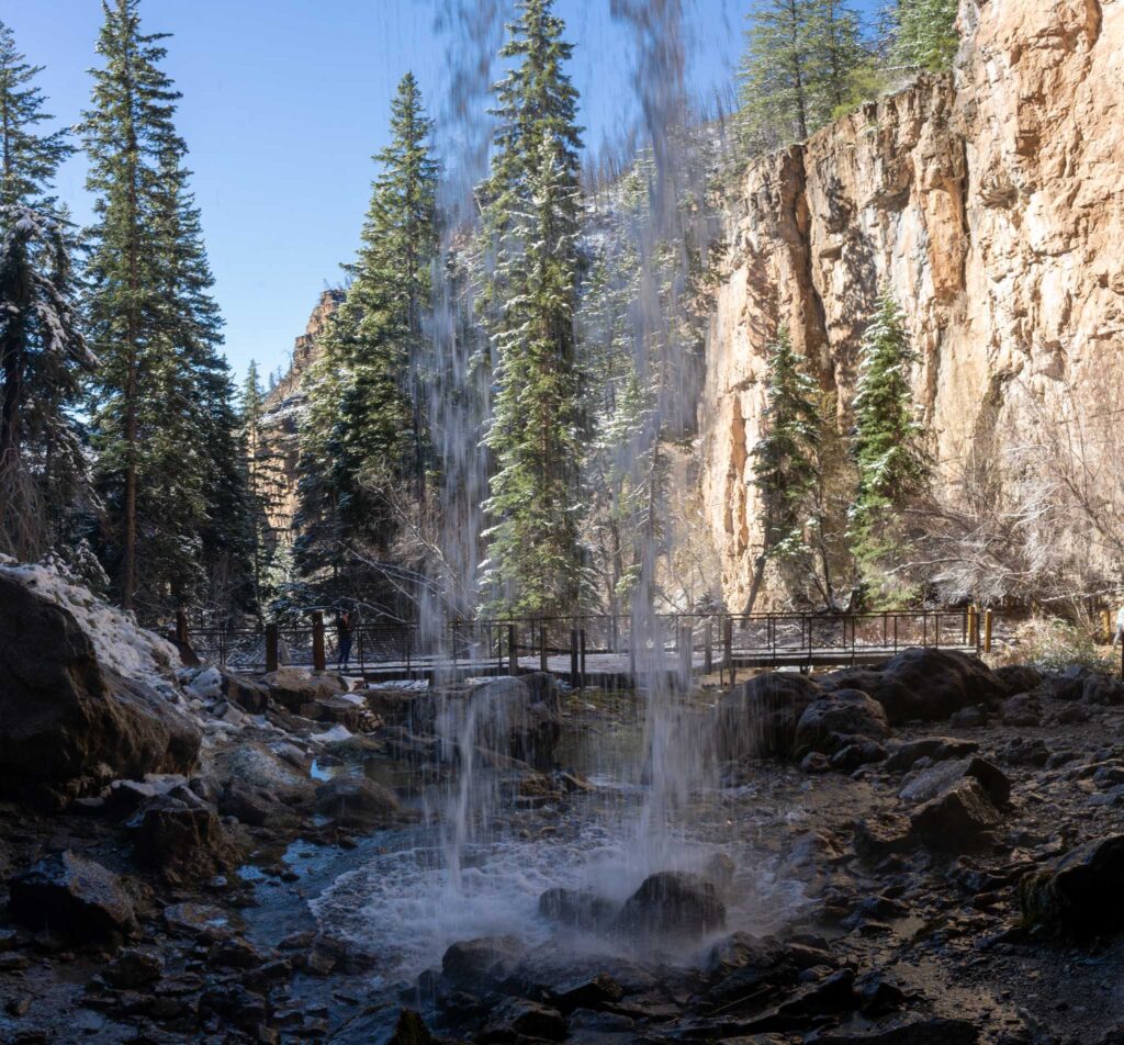 Walking behind waterfall